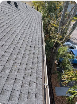 Illustrative close-up of residential gutter cleaning
